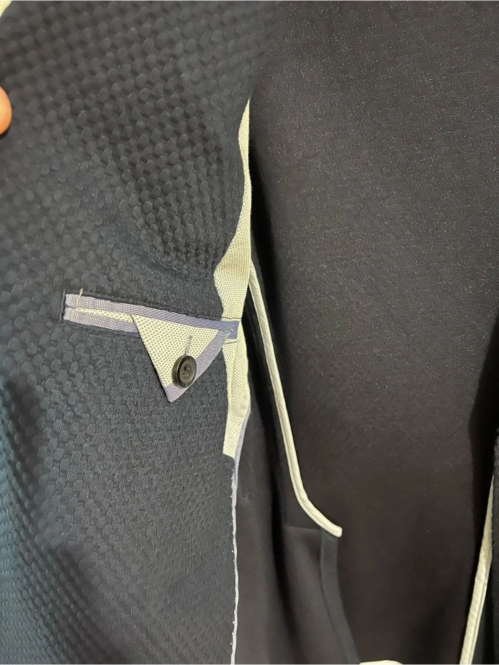 MANGO Man navy blazer features a textured microstructure fabric